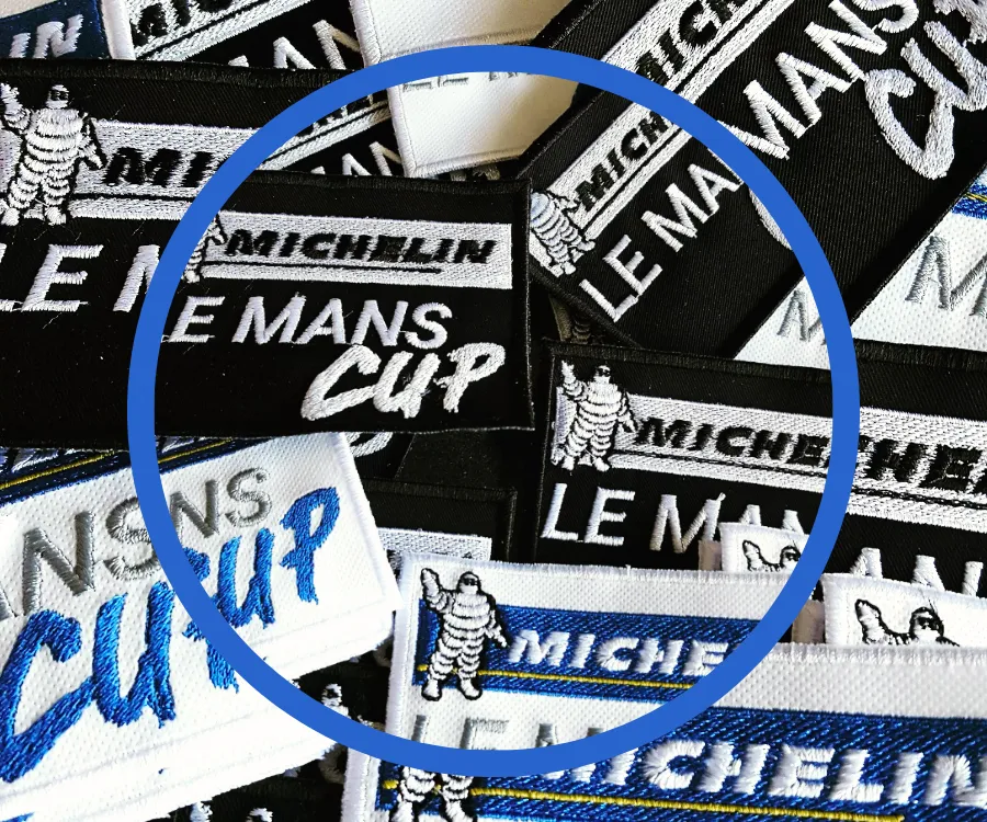 Écussons brodés Le Mans Cup – Réalisations sur mesure par Atelier Brod’Art Créations à Chaudun, près de Soissons.